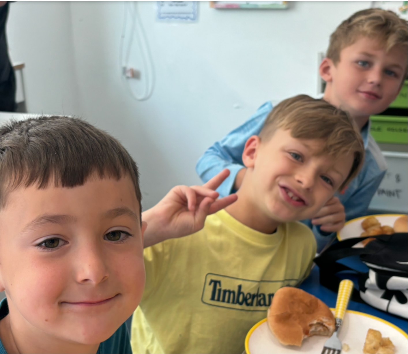 Children enjoying lunch together at holiday club
